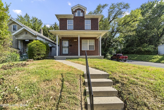 1601 Wilson Ave, Louisville, KY 40210 - american foursquare style home featuring brick siding, a porch, and a front lawn