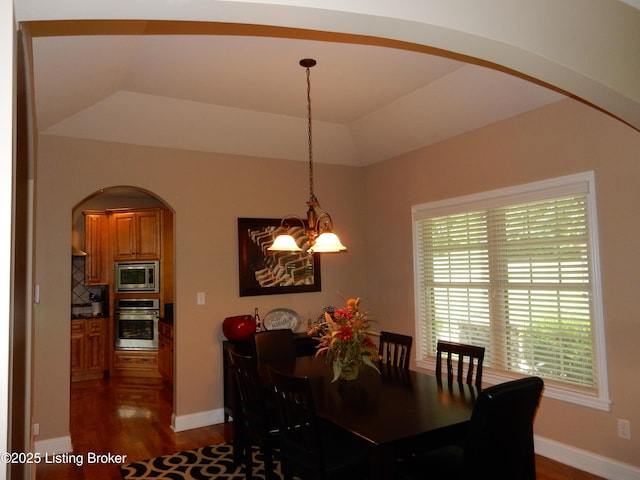 193 Pare Ct, Shepherdsville, KY 40165 - dining space featuring arched walkways, a chandelier, and dark wood-style flooring