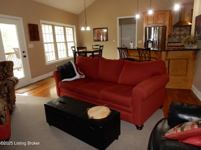 193 Pare Ct, Shepherdsville, KY 40165 - living area featuring vaulted ceiling, light wood-style floors, and a chandelier
