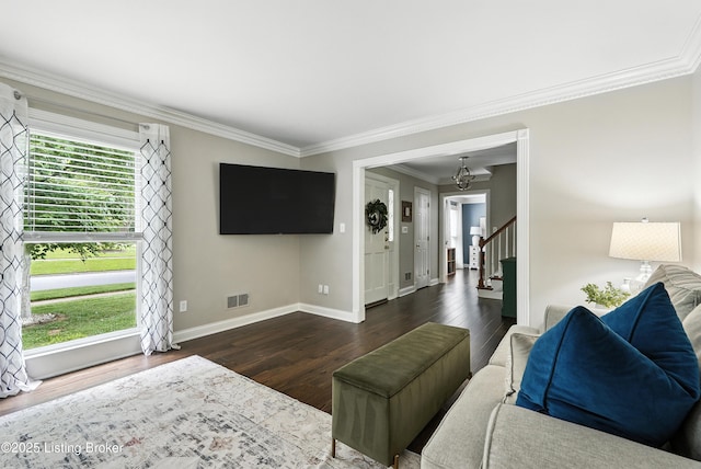 12512 Kirkham Rd, Louisville, KY 40299 - living area with stairway, plenty of natural light, crown molding, and dark wood-style floors