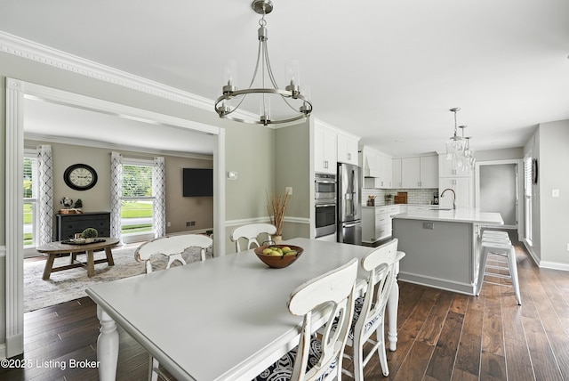 12512 Kirkham Rd, Louisville, KY 40299 - dining area featuring a chandelier, dark wood-style floors, and crown molding