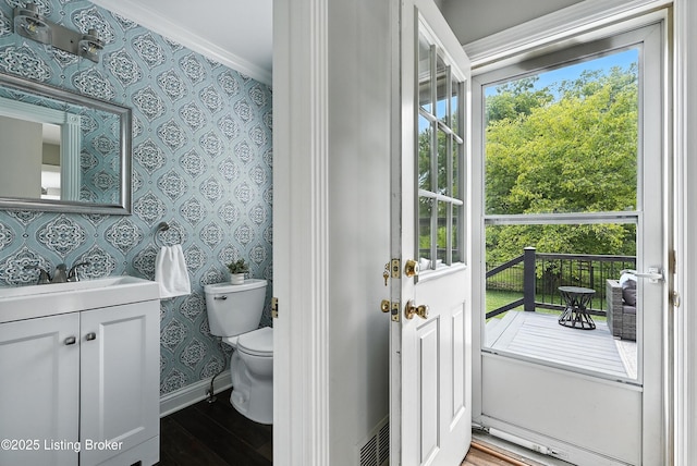 12512 Kirkham Rd, Louisville, KY 40299 - half bathroom with wallpapered walls, wood finished floors, vanity, and ornamental molding