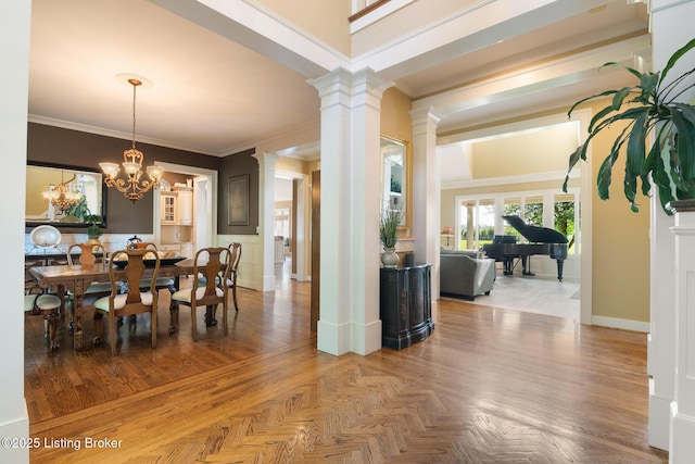 9906 Glen Vista Dr, Prospect, KY 40059 - dining room with decorative columns, crown molding, and a chandelier