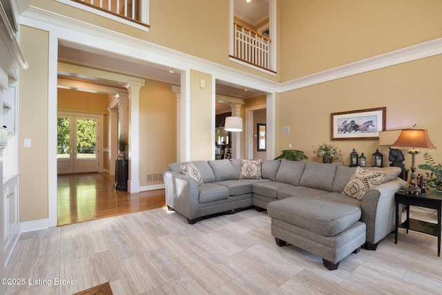 9906 Glen Vista Dr, Prospect, KY 40059 - living area featuring a towering ceiling and decorative columns