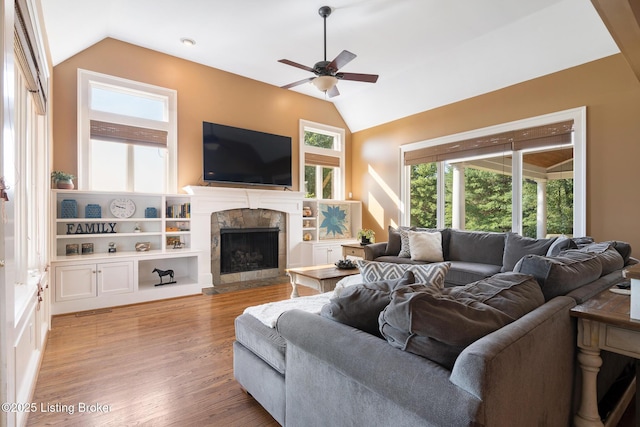 9906 Glen Vista Dr, Prospect, KY 40059 - living area featuring lofted ceiling, a ceiling fan, a tile fireplace, and wood finished floors