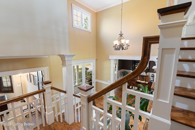 9906 Glen Vista Dr, Prospect, KY 40059 - staircase featuring a chandelier, wood finished floors, and a high ceiling