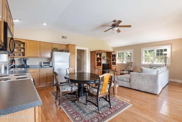 9906 Glen Vista Dr, Prospect, KY 40059 - dining area featuring vaulted ceiling, ceiling fan, and light wood-type flooring