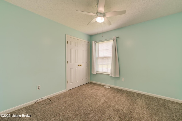 318 Tecumseh Dr, Shepherdsville, KY 40165 - unfurnished bedroom with carpet flooring, a textured ceiling, a closet, and ceiling fan