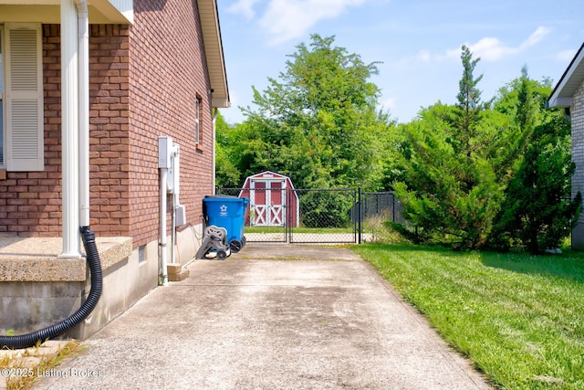 318 Tecumseh Dr, Shepherdsville, KY 40165 - view of home's exterior with brick siding, a storage shed, and driveway