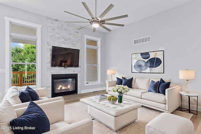 7103 Star Barn Ln, Crestwood, KY 40014 - living area featuring wood finished floors, a ceiling fan, and a large fireplace
