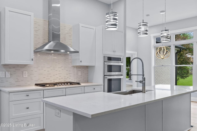 7103 Star Barn Ln, Crestwood, KY 40014 - kitchen featuring wall chimney exhaust hood, stainless steel appliances, backsplash, and white cabinetry