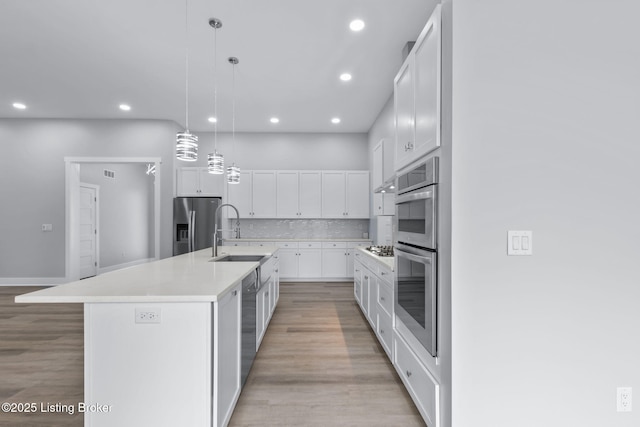 7103 Star Barn Ln, Crestwood, KY 40014 - kitchen with appliances with stainless steel finishes, recessed lighting, white cabinetry, light countertops, and tasteful backsplash