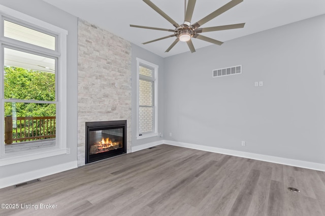 7103 Star Barn Ln, Crestwood, KY 40014 - unfurnished living room with healthy amount of natural light, a fireplace, a ceiling fan, and wood finished floors