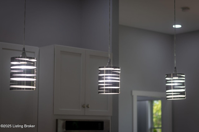 7103 Star Barn Ln, Crestwood, KY 40014 - kitchen view of a chandelier, white cabinetry, and hanging light fixtures