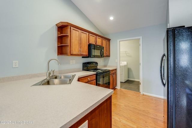 6708 Island Pointe Pl, Louisville, KY 40258 - kitchen with black appliances, washer / clothes dryer, open shelves, light wood-type flooring, and brown cabinets