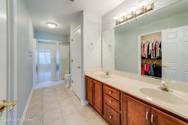 6708 Island Pointe Pl, Louisville, KY 40258 - bathroom with tile patterned floors, a shower stall, double vanity, and a walk in closet