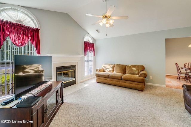 6708 Island Pointe Pl, Louisville, KY 40258 - carpeted living area featuring vaulted ceiling, a ceiling fan, and a tile fireplace