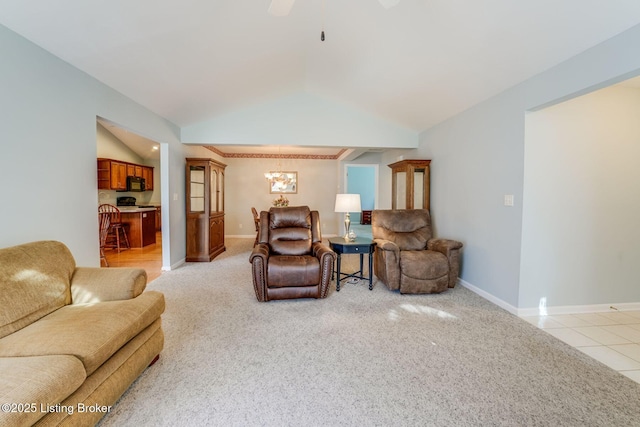 6708 Island Pointe Pl, Louisville, KY 40258 - living room with vaulted ceiling, light carpet, ceiling fan, a chandelier, and light tile patterned floors