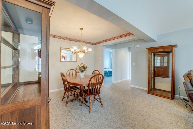 6708 Island Pointe Pl, Louisville, KY 40258 - carpeted dining area with baseboards and a chandelier