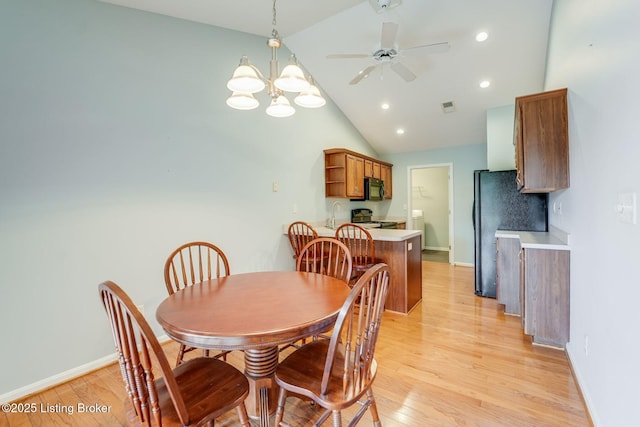 6708 Island Pointe Pl, Louisville, KY 40258 - dining area with light wood-style flooring, a chandelier, a ceiling fan, recessed lighting, and high vaulted ceiling