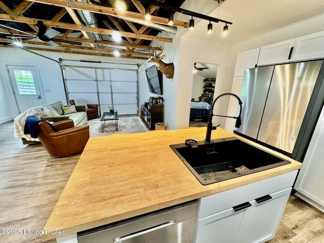 9068 Mackville Rd, Springfield, KY 40069 - garage featuring a sink and freestanding refrigerator