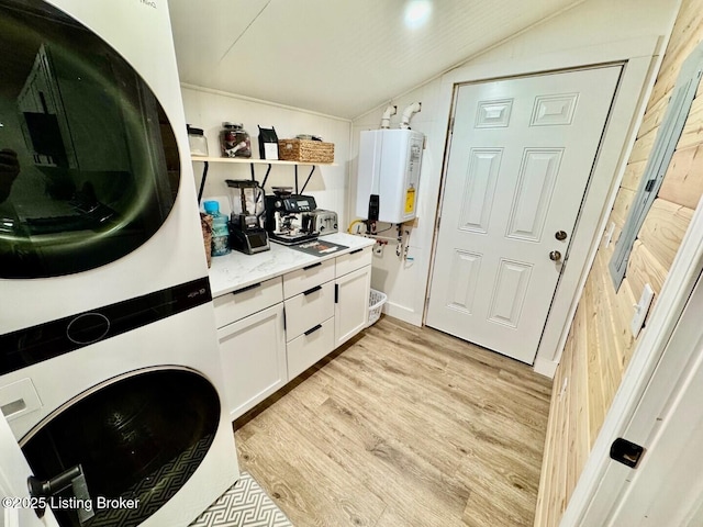 9068 Mackville Rd, Springfield, KY 40069 - washroom featuring water heater, stacked washer / dryer, and light wood-style flooring