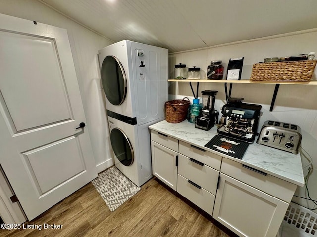 9068 Mackville Rd, Springfield, KY 40069 - laundry area featuring stacked washer / dryer and light wood-style flooring