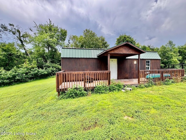 9068 Mackville Rd, Springfield, KY 40069 - rear view of house featuring a yard, a metal roof, a wooden deck, and a standing seam roof