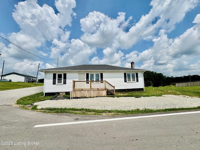 6234 Mackville Rd, Springfield, KY 40069 - manufactured / mobile home featuring a wooden deck and a chimney