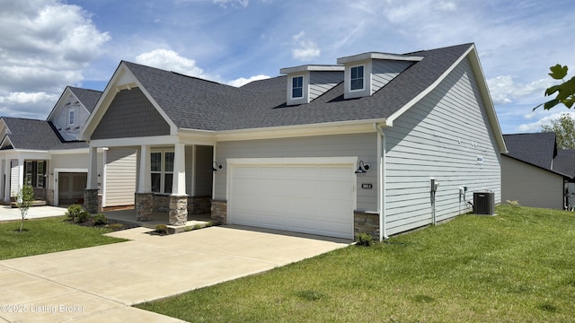 3611 Fordham Pk Dr, Louisville, KY 40245 - view of front facade featuring driveway, a front lawn, an attached garage, roof with shingles, and stone siding