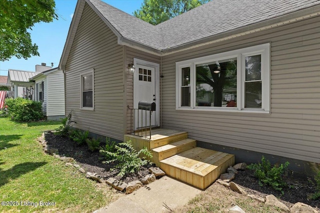 428 Pennsylvania Ave, Elizabethtown, KY 42701 - property entrance with a lawn, roof with shingles, and a chimney