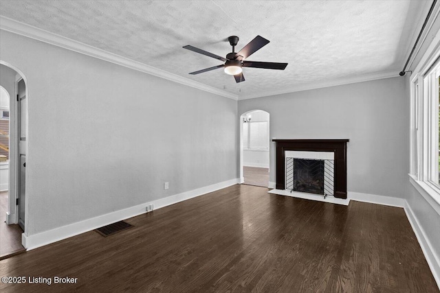 428 Pennsylvania Ave, Elizabethtown, KY 42701 - unfurnished living room with arched walkways, wood finished floors, a fireplace with flush hearth, a ceiling fan, and a textured ceiling