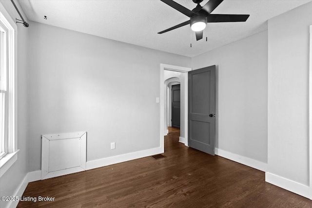 428 Pennsylvania Ave, Elizabethtown, KY 42701 - empty room featuring arched walkways, wood finished floors, a ceiling fan, and a textured ceiling