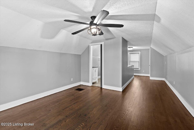 428 Pennsylvania Ave, Elizabethtown, KY 42701 - additional living space with a textured ceiling, wood finished floors, lofted ceiling, and a ceiling fan