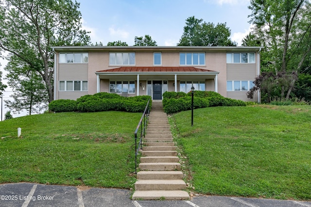 4116 Stoneview Dr Unit 1, Louisville, KY 40207 - view of property featuring a front yard, uncovered parking, stairway, and a standing seam roof