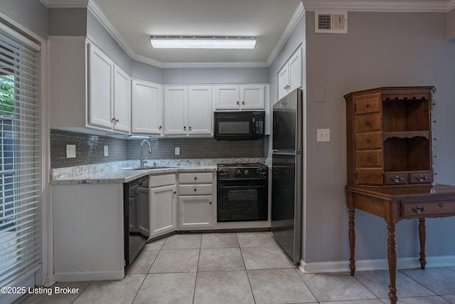 4116 Stoneview Dr Unit 1, Louisville, KY 40207 - kitchen featuring black appliances, tasteful backsplash, white cabinetry, light tile patterned floors, and light stone countertops