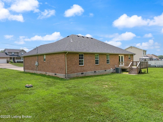 223 Rebecca Ann Ct, Elizabethtown, KY 42701 - back of house featuring brick siding, crawl space, roof with shingles, a wooden deck, and a yard