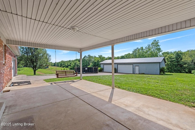 360 Van Buren Rd, Mount Eden, KY 40046 - view of patio / terrace featuring an outdoor structure, a garage, and view of scattered trees