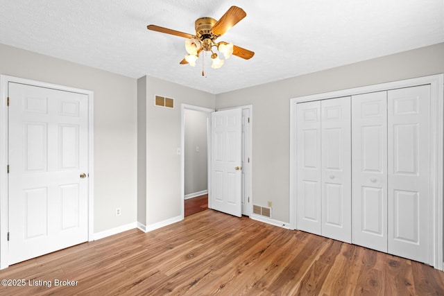 360 Van Buren Rd, Mount Eden, KY 40046 - unfurnished bedroom with wood finished floors, a closet, ceiling fan, and a textured ceiling