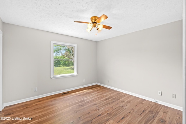 360 Van Buren Rd, Mount Eden, KY 40046 - unfurnished room featuring wood finished floors, a ceiling fan, and a textured ceiling