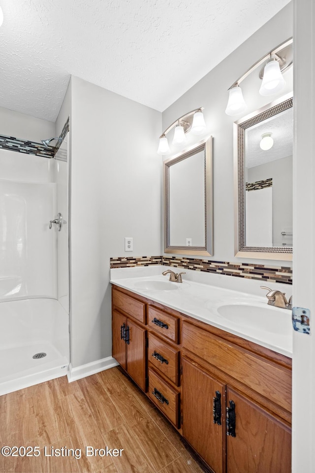 360 Van Buren Rd, Mount Eden, KY 40046 - bathroom featuring a textured ceiling, wood finished floors, double vanity, and a shower