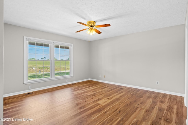 360 Van Buren Rd, Mount Eden, KY 40046 - spare room with wood finished floors, a ceiling fan, and a textured ceiling