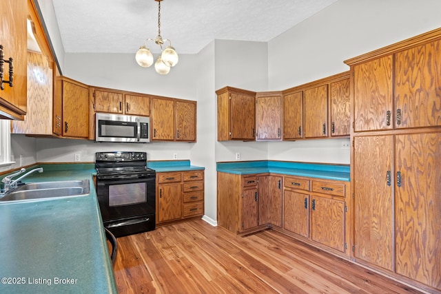 360 Van Buren Rd, Mount Eden, KY 40046 - kitchen featuring stainless steel microwave, electric range, brown cabinetry, light wood-type flooring, and a chandelier