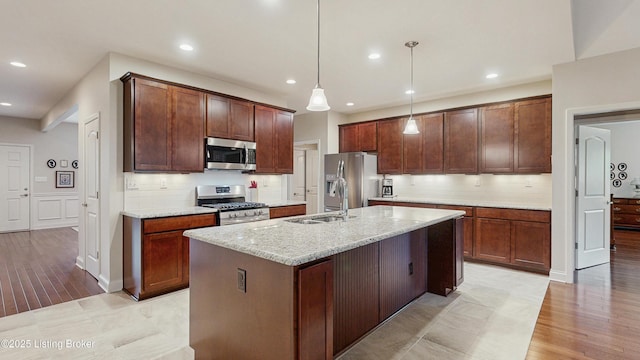 734 Dehart Ln, Louisville, KY 40243 - kitchen with stainless steel appliances, recessed lighting, tasteful backsplash, light wood-style flooring, and light stone counters