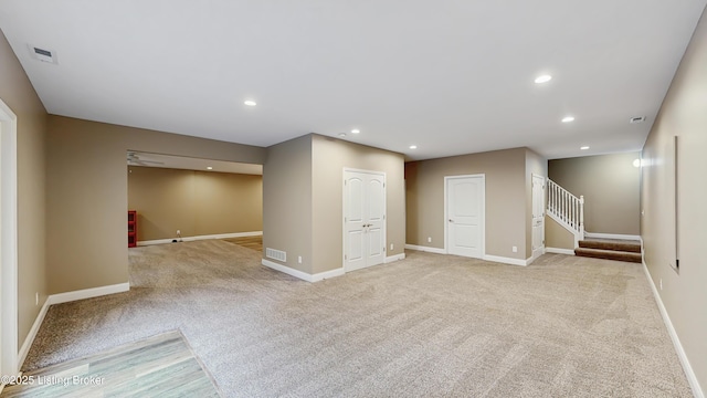 734 Dehart Ln, Louisville, KY 40243 - basement featuring light colored carpet, stairway, and recessed lighting