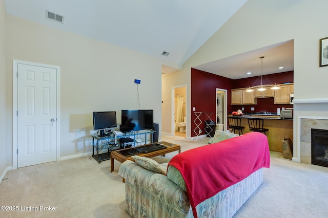 344 S Dorsey Ln Unit 344, Louisville, KY 40223 - living room featuring light carpet, high vaulted ceiling, and a fireplace