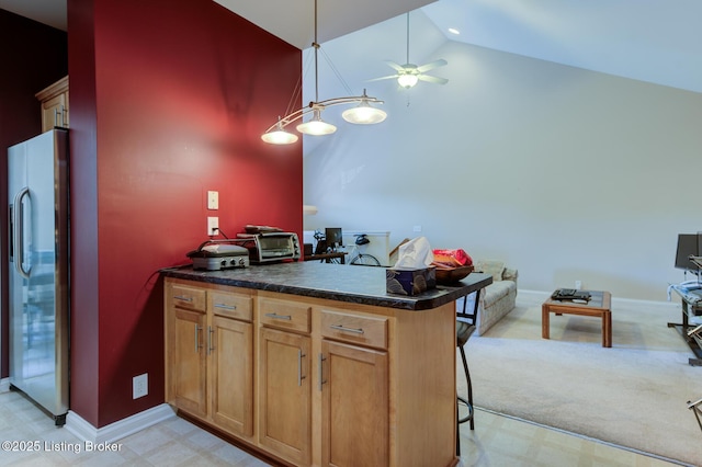 344 S Dorsey Ln Unit 344, Louisville, KY 40223 - kitchen featuring stainless steel fridge with ice dispenser, a ceiling fan, a peninsula, a kitchen bar, and dark countertops