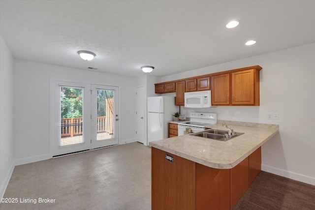 7230 Michael Benjamin Cir, Crestwood, KY 40014 - kitchen featuring white appliances, light countertops, brown cabinetry, a peninsula, and recessed lighting