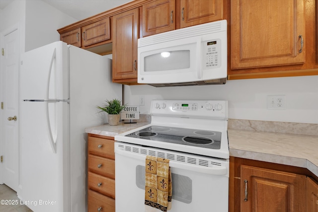 7230 Michael Benjamin Cir, Crestwood, KY 40014 - kitchen featuring white appliances, light countertops, and brown cabinets