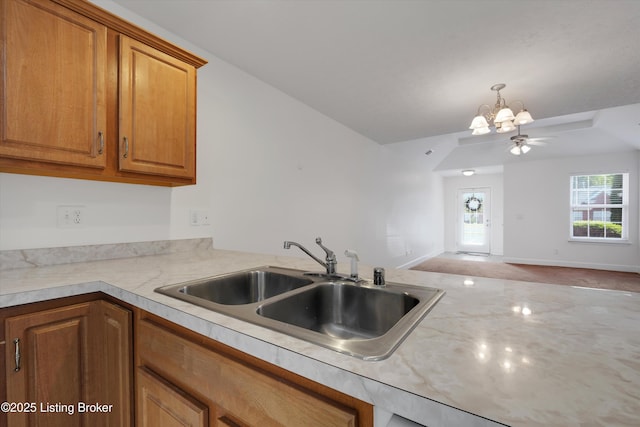 7230 Michael Benjamin Cir, Crestwood, KY 40014 - kitchen with light countertops, a chandelier, brown cabinets, open floor plan, and pendant lighting